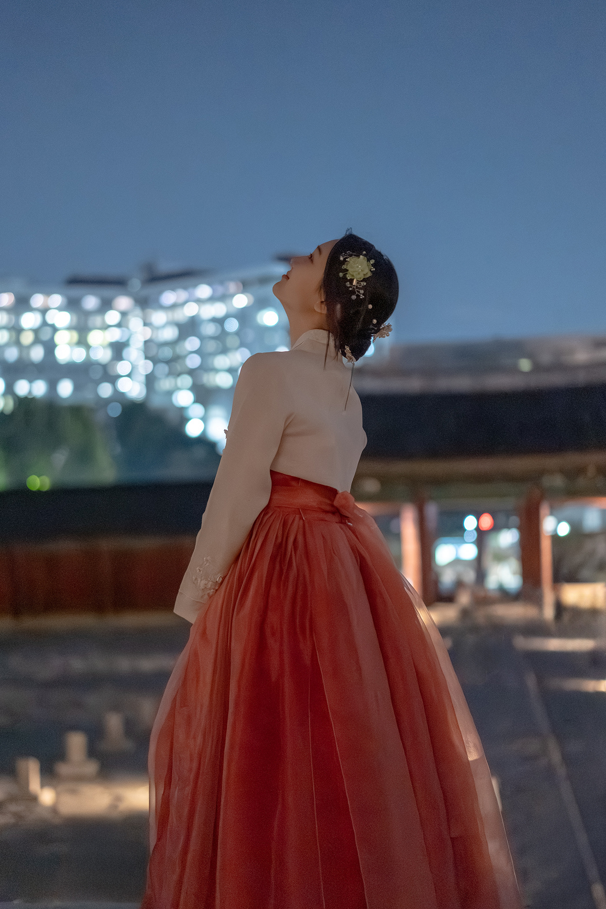 A cinematic evening hanbok portrait in Seoul